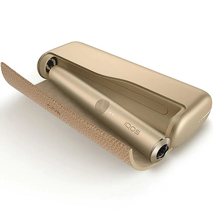 IQOS Iluma Prime gold khaki device cradle with open end and textured exterior