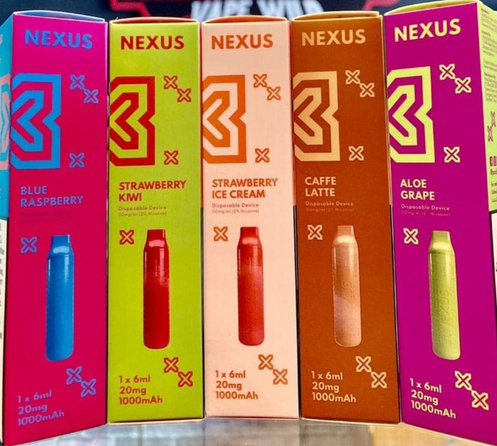 Assorted flavor boxes of disposable vape devices with different colored cartridges